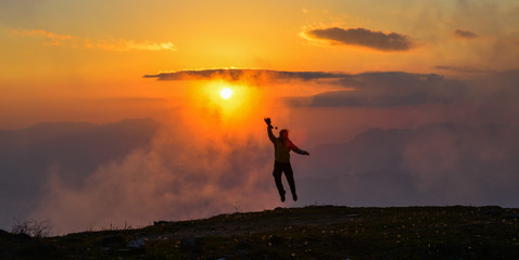 A young woman standing on mountain