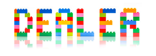 Block shape with word "DEALER". Business concept.