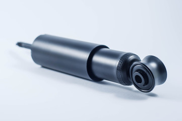 car shock absorber on white background