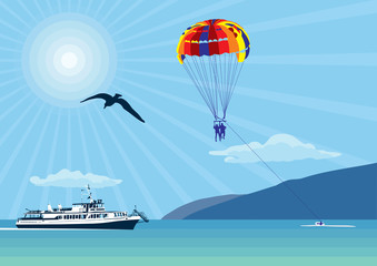 Parachute over the sea. Outdoor activities over the sea and mountains.