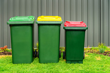 Australian home rubbish bins set on back yard