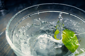 tropical fruits Lime fall deeply under water with a big splash