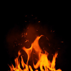 Fototapeta na wymiar Texture of burn fire with particles embers. Flames on isolated black background.
