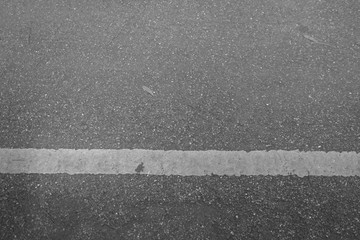 Fototapeta premium The road with white lines is horizontal