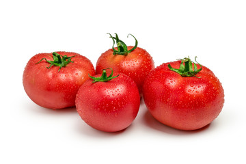 Four fresh red tomatoes isolated on white background
