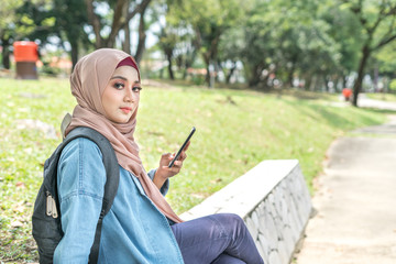 Fototapeta premium Veiled teenager at outdoor park.