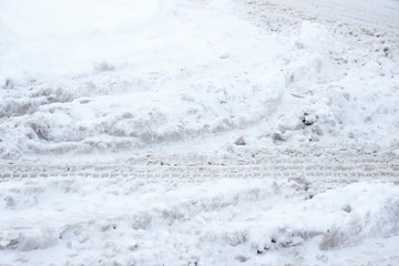 Fototapeta na wymiar problem after snowfall - snow on the city road, snow porridge