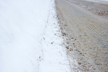 problem after snowfall - snow on the city road, snow porridge