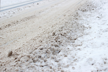 problem after snowfall - snow on the city road, snow porridge