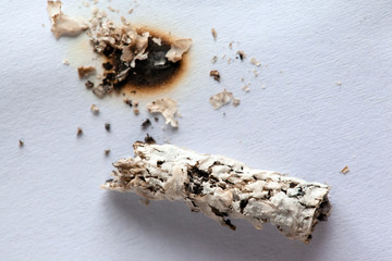 cigarette ash and burned hole