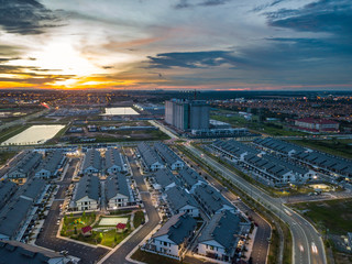 Aerial view of residential township during sunset.