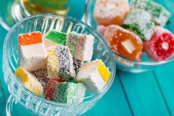 various pieces of turkish delight lokum and black tea