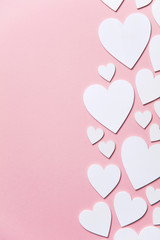 White hearts on a pastel pink background. Valentine's day, Mother's day background