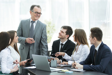 senior businessman discussing with business team to work issues