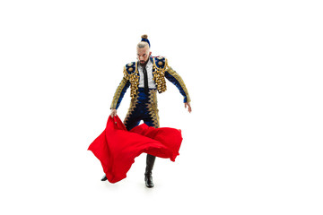 Torero in blue and gold suit or typical spanish bullfighter isolated over white studio background....