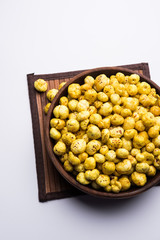Roasted Phool Makhana or Crispy Lotus pops Seed served in a bowl, selective focus