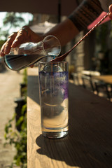  bartender preparing cocktail on a sunny summer day
