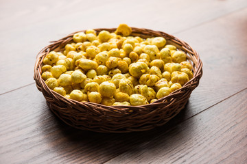 Roasted Phool Makhana or Crispy Lotus pops Seed served in a bowl, selective focus