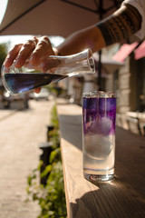  bartender preparing cocktail on a sunny summer day