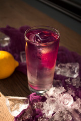  lavender lemonade with ice on the windowsill on a hot sunny day