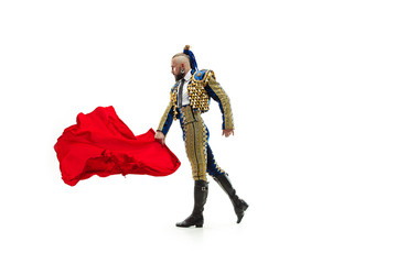 Torero in blue and gold suit or typical spanish bullfighter isolated over white studio background....