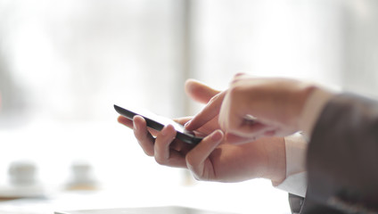 close up.businessman pressing the screen of the smartphone