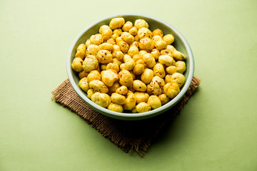 Roasted Phool Makhana or Crispy Lotus pops Seed served in a bowl, selective focus