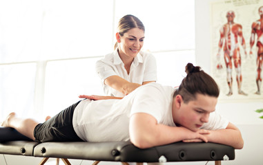 Obraz premium A Modern rehabilitation physiotherapy woman worker with client