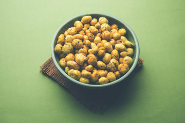 Roasted Phool Makhana or Crispy Lotus pops Seed served in a bowl, selective focus