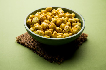Roasted Phool Makhana or Crispy Lotus pops Seed served in a bowl, selective focus