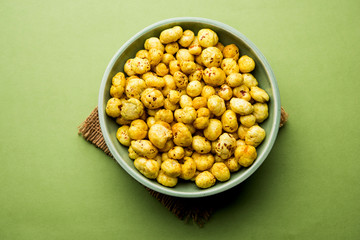 Roasted Phool Makhana or Crispy Lotus pops Seed served in a bowl, selective focus