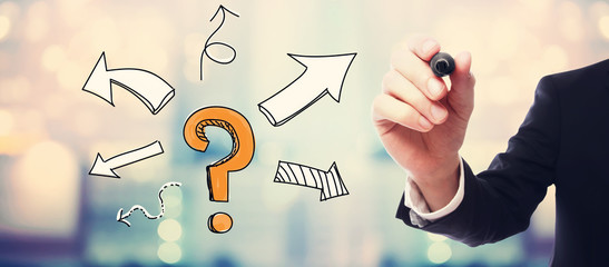 Question mark with arrows with businessman on blurred abstract background