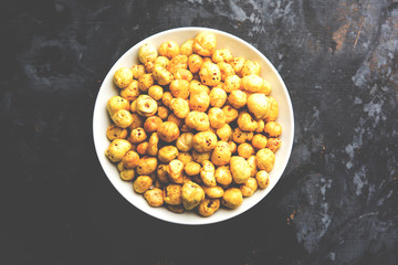 Roasted Phool Makhana or Crispy Lotus pops Seed served in a bowl, selective focus