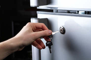 Metal refrigerator door with lock. Food storage and freezing. Diet