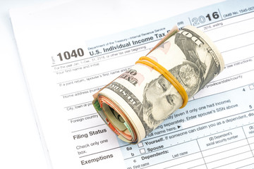 Tax form and banknote with financial concept.