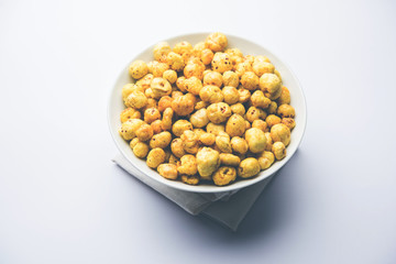Roasted Phool Makhana or Crispy Lotus pops Seed served in a bowl, selective focus