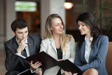 close up.colleagues discussing the financial document in the lobby of the Bank
