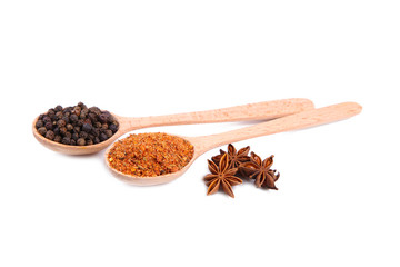 Spices mix on wooden spoons isolated on a white background. Top view
