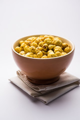 Roasted Phool Makhana or Crispy Lotus pops Seed served in a bowl, selective focus