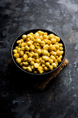 Roasted Phool Makhana or Crispy Lotus pops Seed served in a bowl, selective focus