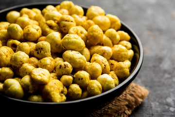 Roasted Phool Makhana or Crispy Lotus pops Seed served in a bowl, selective focus