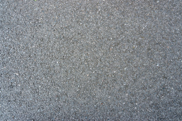Surface rough of black asphalt concrete background. Seamless gray road.