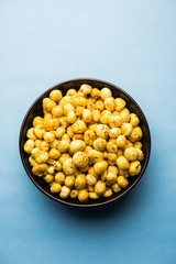 Roasted Phool Makhana or Crispy Lotus pops Seed served in a bowl, selective focus