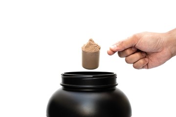 Whey protein powder chocolate flavour isolated with scoop measure for fitness and bodybuilding gaining muscle on white background.Concept of Food,Health care,Sport.Copy space for text.