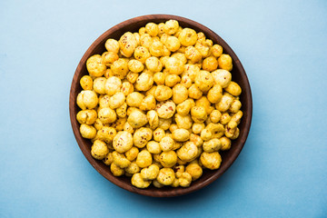 Roasted Phool Makhana or Crispy Lotus pops Seed served in a bowl, selective focus