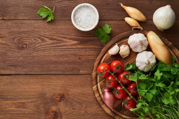 Menu, recipe, mock up, banner. Food seasoning background. Spices, Herbs and round wooden cutting...