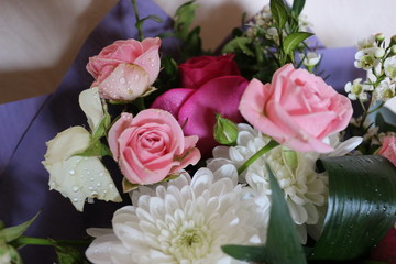 A beautiful bouquet of roses and other flowers is a welcome gift for every woman.