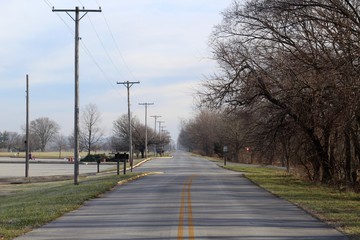 Fototapeta premium A long empty road in the country on a sunny morning. 