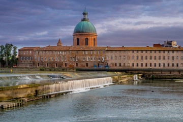 View of Garonne river in Toulouse city center at sunset