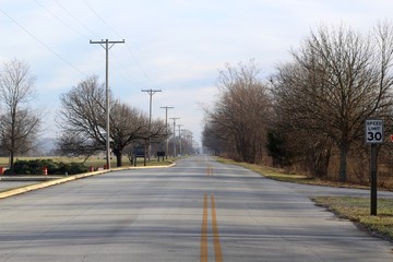 Fototapeta premium A long empty highway road in the countryside.